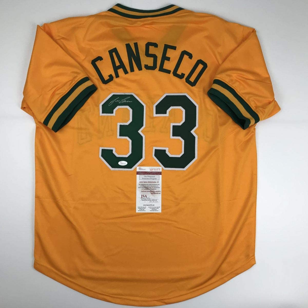 Autographed/Signed Jose Canseco Oakland Yellow Baseball Jersey Beckett BAS COA