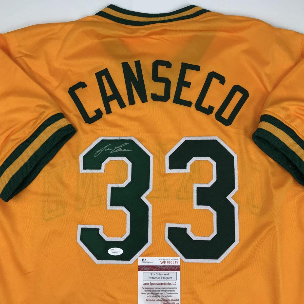 Autographed/Signed Jose Canseco Oakland Yellow Baseball Jersey Beckett BAS COA